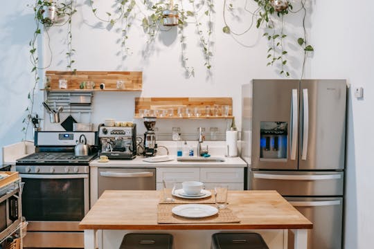 a%20kitchen%20with%20butcher%20block%20counters%20and%20stainless%20appliances a%20kitchen%20with%20butcher%20block%20counters%20and%20stainless%20appliances